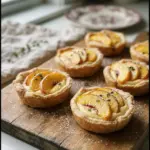 Mini Peach and Cream Cheese Tarts garnished with fresh peach slices